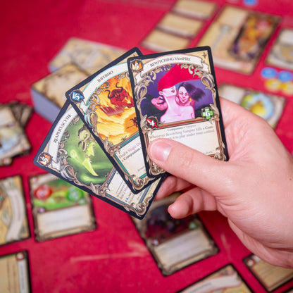 A hand of cards showing the different fantasy artwork in the game such as magic spells equipment companions to level up your hero